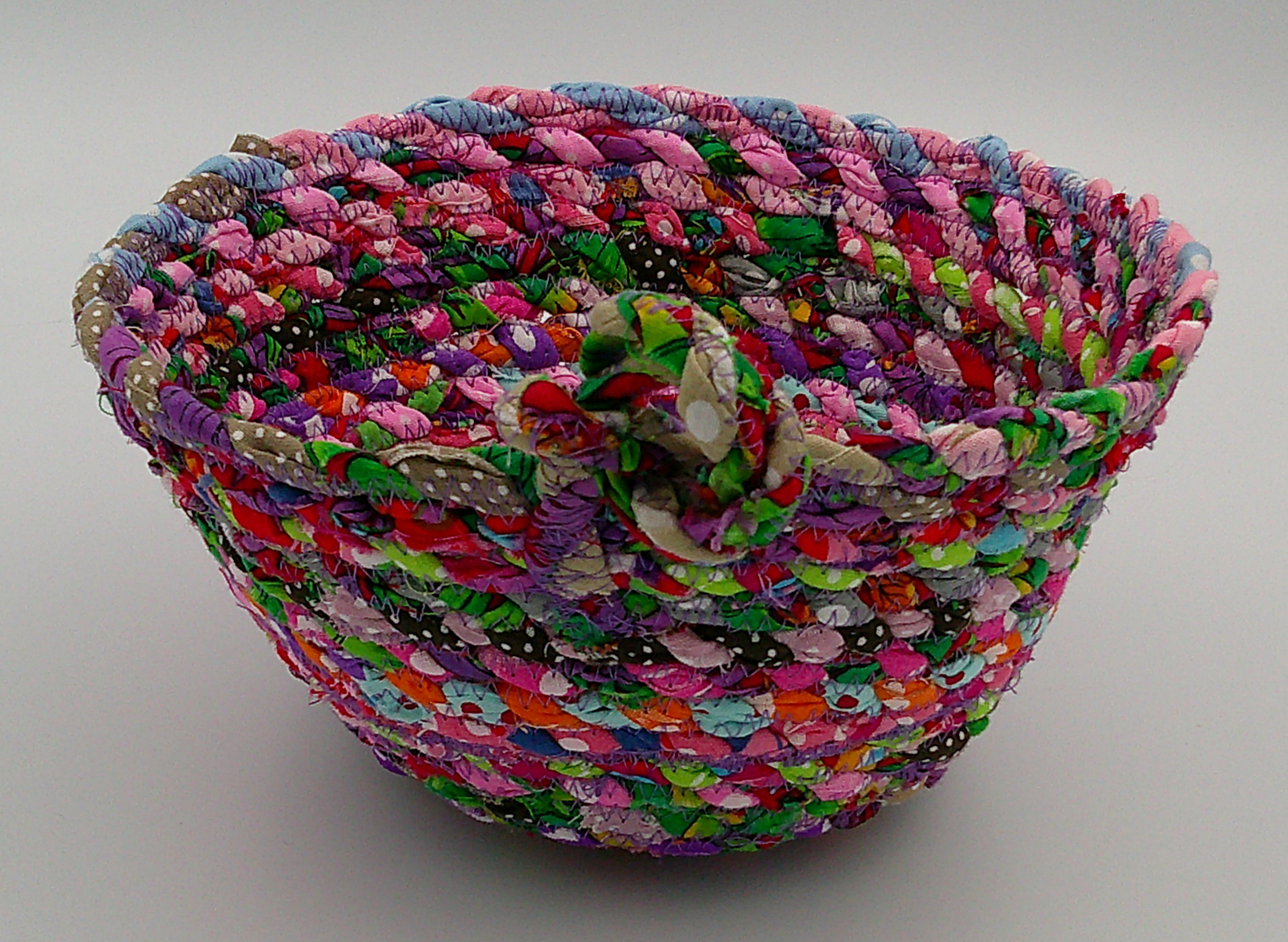 This view shows both the inside and outside of the basket with its big knot for embellishment.  This view shows both the inside and outside of the basket with its big knot for embellishment.